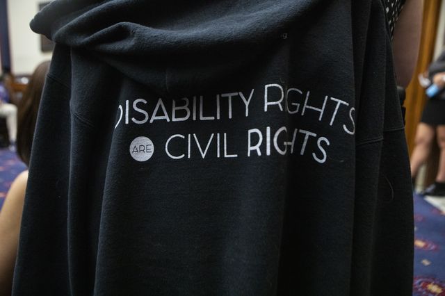 An attendee’s sweatshirt at a July reception in Washington, D.C. celebrating the 32nd anniversary of the passing of the Americans with Disabilities Act. Advocates for people with disabilities say that the Supreme Court’s reasoning in Dobbs v. Jackson Women’s Health Organization this past June — most notably overturning the constitutional right to an abortion —  could also threaten important rights benefiting people in the disabled community.